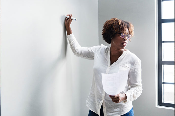 Teacher and whiteboard